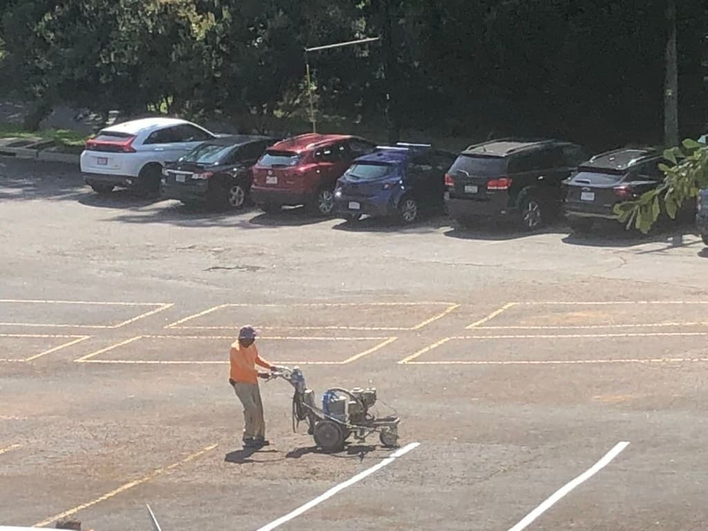 The lines designating the parking spaces in the lower lot have been repainted.