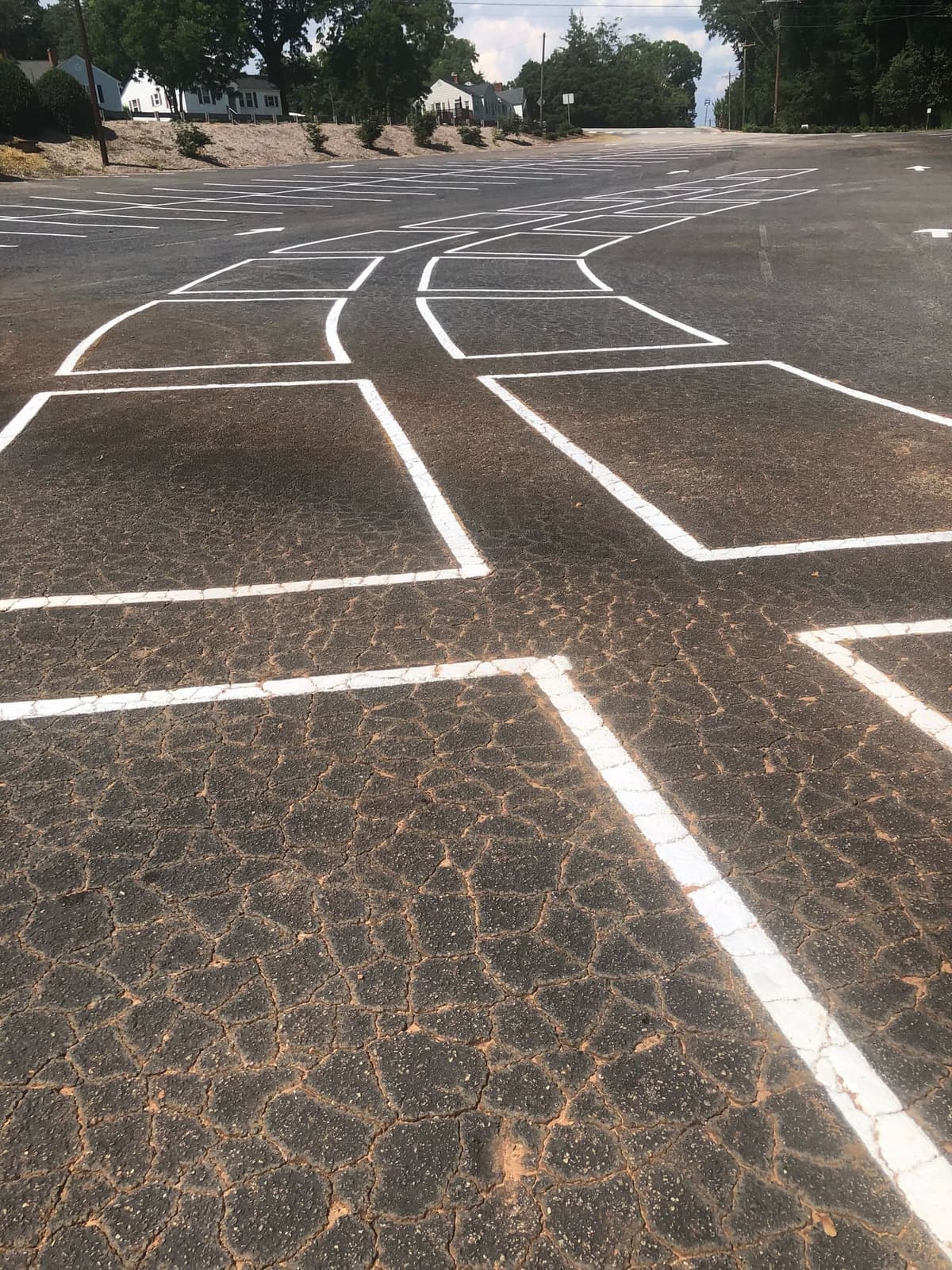 The lines designating the parking spaces in the lower lot have been repainted.