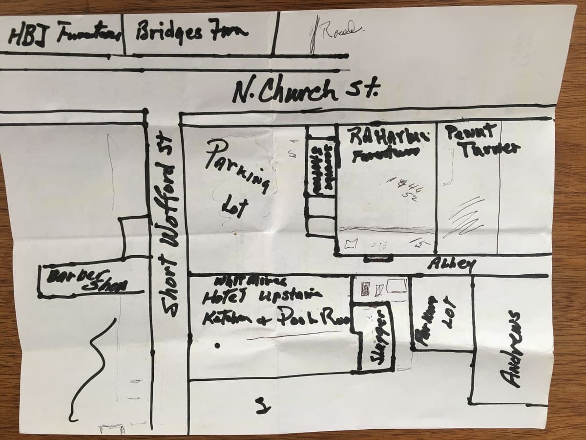Sketch by Jim Harbison showing the location of the Whitmires' hotel and cafe on the now nonexistent Short Wofford Street across the alley from his family's furniture store parking lot. On the right side of the building the area labeled "Slugger" identifies the equipment storage and changing area for the team. "HBJ Furniture" is the location of the former landmark Hammond Brown Jennings store, familiar to many current residents, on North Church Street.